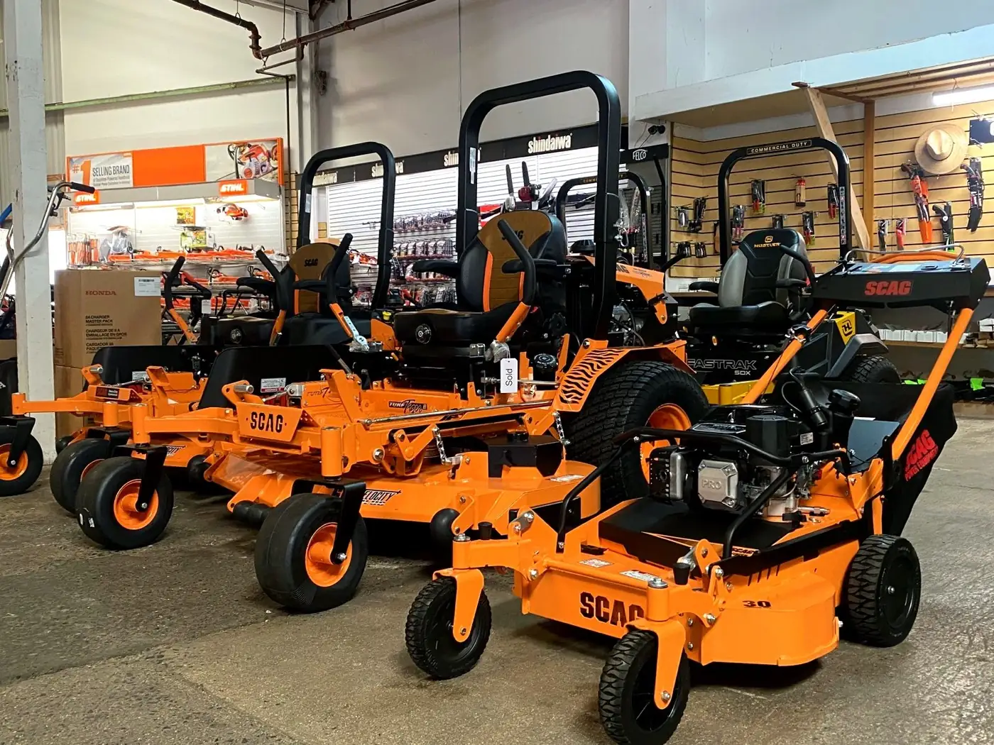 SCAG zero-turn and walk-behind mowers on the showroom floor at Maui Power Equipment in Wailuku