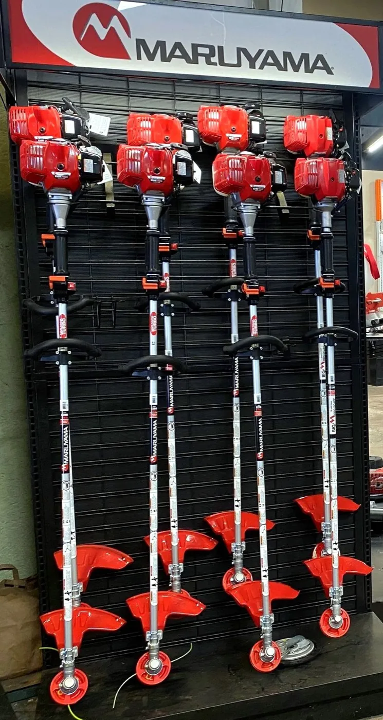 Maruyama string trimmers on a display rack at Maui Power Equipment