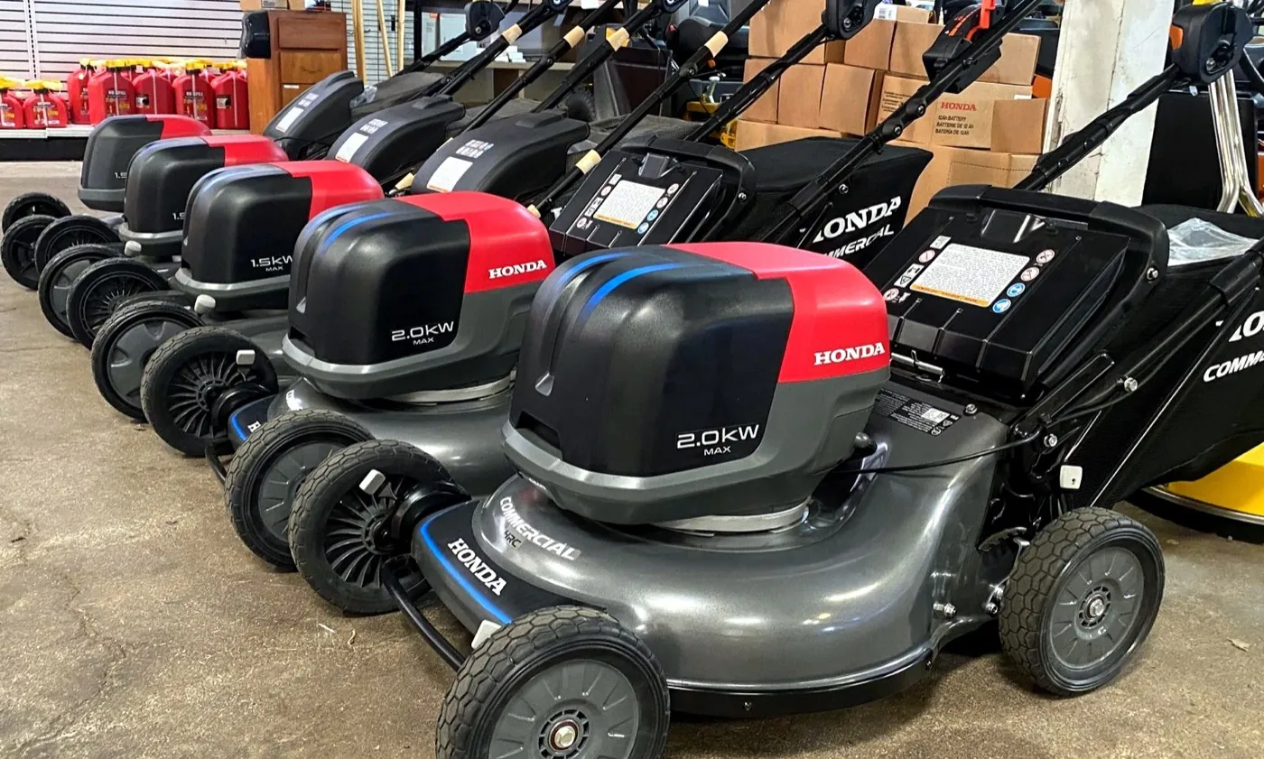 Row of Honda battery-powered lawn mowers in the Maui Power Equipment showroom